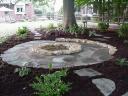 Flagstone Patio Around Natural Stone Fire Pit